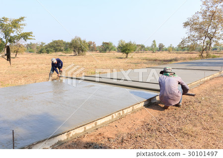 workers were building a concrete road 30101497