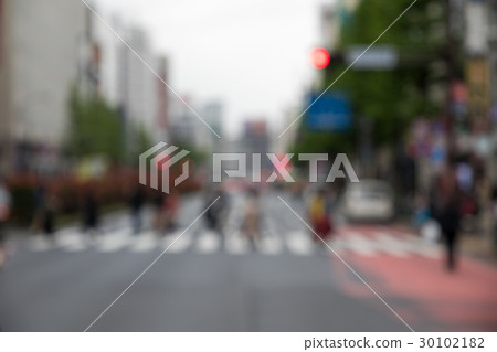 People crossing a pedestrian crossing 30102182