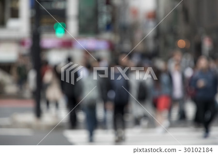 People crossing a pedestrian crossing 30102184