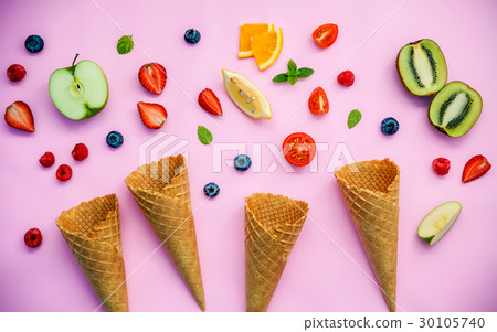 Cones and colorful various fruits . 30105740