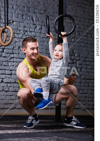 Happy father and little son exercising with Happy father and little son exercising with 30106656