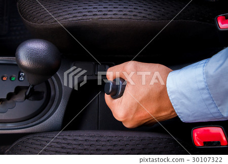 A business man holding gear  30107322