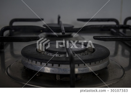 Gas stove in the kitchen - Dark closeup 30107383