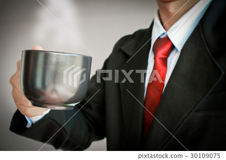 Business man smiling with red tie drinking Business man smiling with red tie drinking 30109075