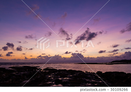 Beautiful rock patterns and sunrise at shore 30109266