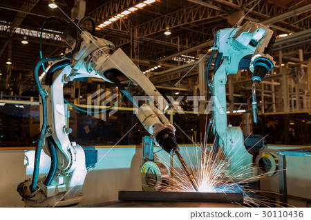 Team robots are test run welding in car factory Team robots are test run welding in car factory 30110436
