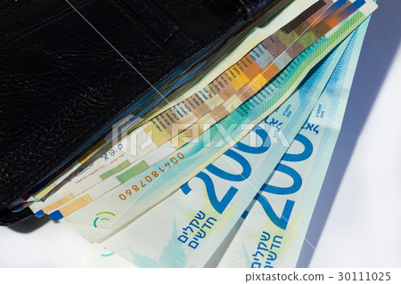 Israeli shekel money bills in close black wallet Israeli shekel money bills in close black wallet 30111025