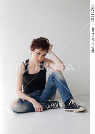 the girl with the short hair sitting on the floor the girl with the short hair sitting on the floor 30111266