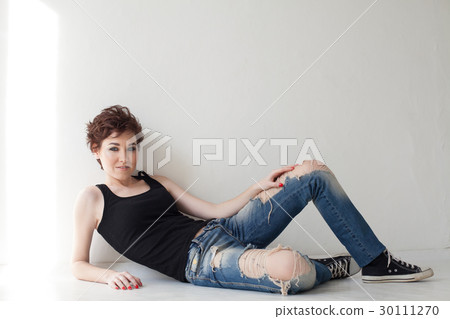 the girl with the short hair sitting on the floor the girl with the short hair sitting on the floor 30111270