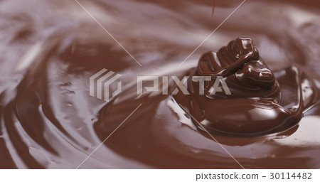 Slow motion of premium dark melted chocolate being 30114482