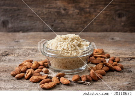 almond flour in a wooden bowl, almonds 30118685
