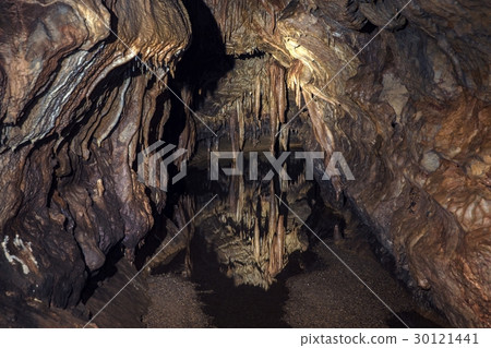 Underground lake sorrunded by rocks Underground lake sorrunded by rocks 30121441