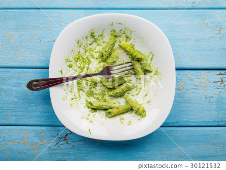 Uneaten spinach pasta Uneaten spinach pasta 30121532