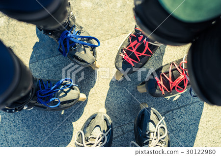 Top view of feet of friends roller skaters Top view of feet of friends roller skaters 30122980