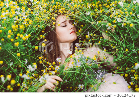 Portrait of young girl with closed eyes in field Portrait of young girl with closed eyes in field 30124172