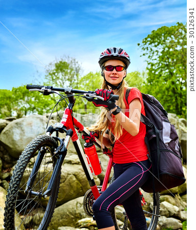 Woman traveling bicycle summer park. Early morning 30126341