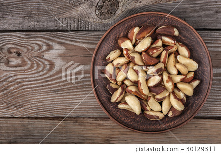 Brazil nuts in a plate 30129311