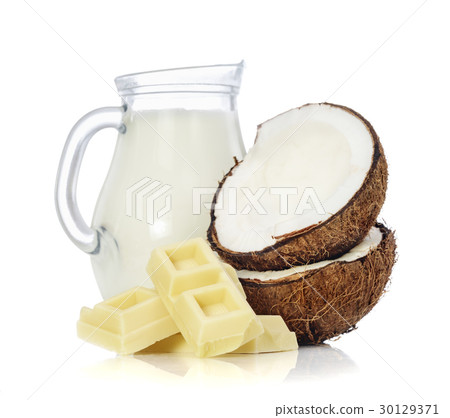 White chocolate pieces, coconut milk in glass jar White chocolate pieces, coconut milk in glass jar 30129371