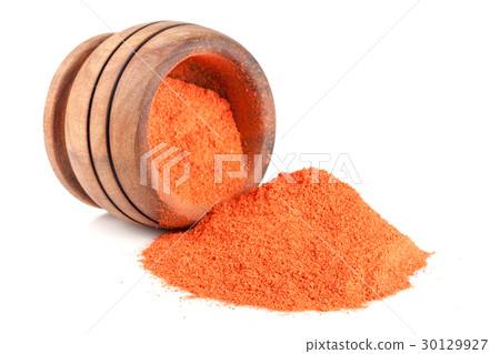 Ground paprika in a wooden bowl isolated on a Ground paprika in a wooden bowl isolated on a 30129927