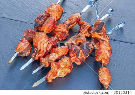 chargrilled meat fillet on metal skewers 30130314