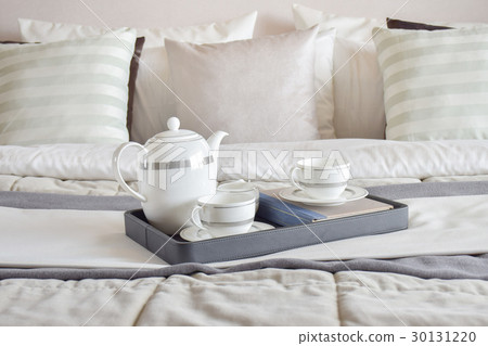 tea cup set on black tray and books in bedroom tea cup set on black tray and books in bedroom 30131220