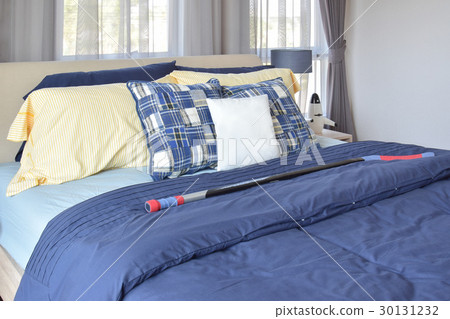 stylish bedroom with blue patterned pillows on bed stylish bedroom with blue patterned pillows on bed 30131232