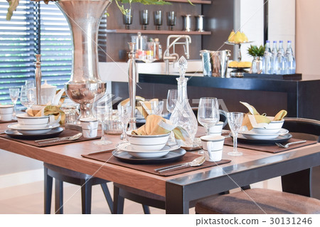 elegant table set in modern style dining room 30131246
