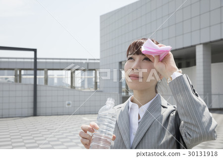 Business woman outdoing measures heat suppression measures hydration Business woman outdoing measures heat suppression measures hydration 30131918