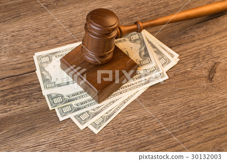 Photo of hammer on banknotes 30132003
