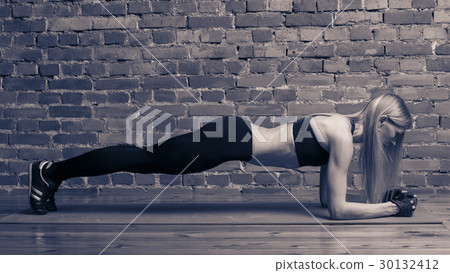Woman doing fitness exercise Woman doing fitness exercise 30132412