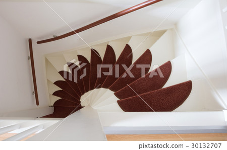 White wooden stairs with red mats 30132707