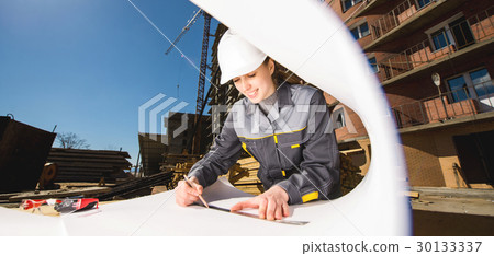 Female worker at a construction 30133337