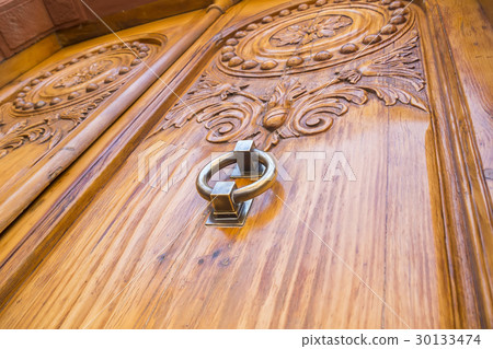 Metal door handle of old wooden door 30133474