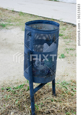 small black metal garbage container or urn on the small black metal garbage container or urn on the 30133883