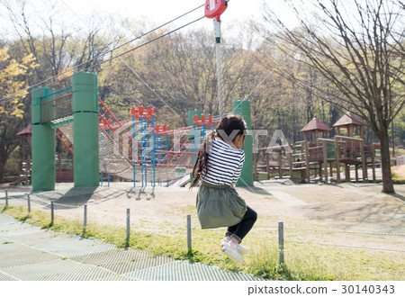 Girls playing in the park 30140343