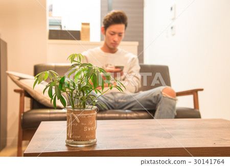 A man living in a one room A man living in a one room 30141764