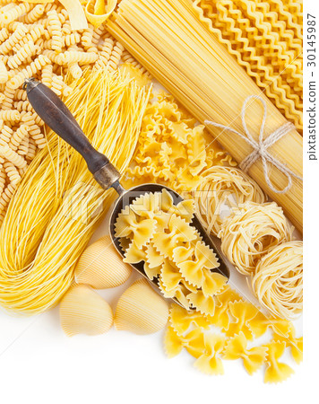 assortment of uncooked pasta on white 30145987