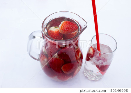 Strawberry drink in a pitcher 30146998