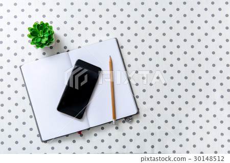 Mobile phone at white sheet of paper Mobile phone at white sheet of paper 30148512
