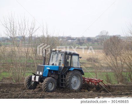 tractor in a field 30148685