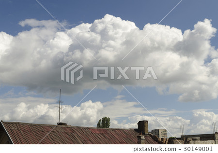 Antenna on the roof and fluffy clouds 30149001