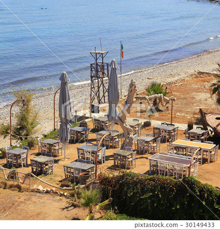 outdoor greek tavern by the sea beach, Crete 30149433