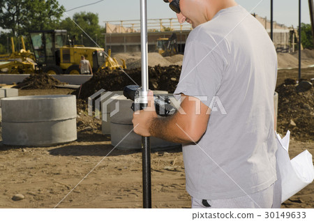 Geodesist at a new build stadium in a village Geodesist at a new build stadium in a village 30149633