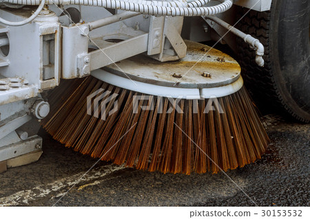 Close up road sweeper machine cleaning city street 30153532