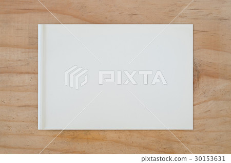 Notebook on table 30153631