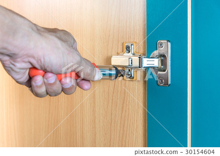 fixing cabinet door hinge using a screwdriver 30154604