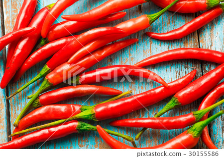 Hot red chili pepper on a old blue color wooden Hot red chili pepper on a old blue color wooden 30155586