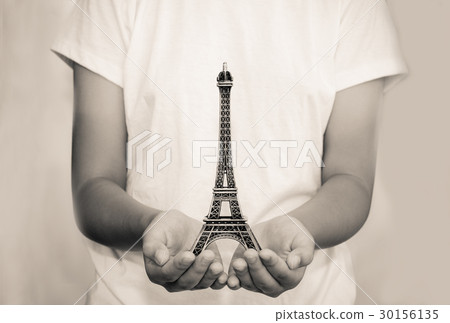 Open hand with a model the Eiffel Tower Open hand with a model the Eiffel Tower 30156135