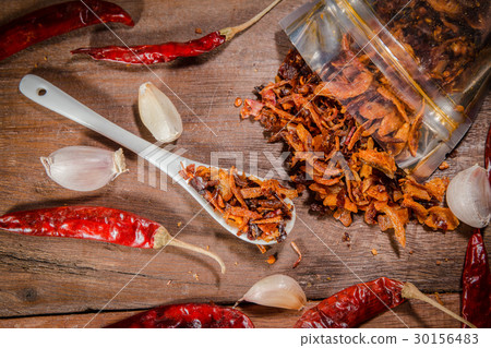 chili sauce on ceramic spoon chili sauce on ceramic spoon 30156483