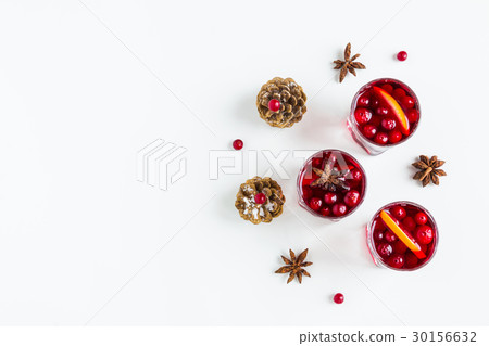Mulled wine in small glasses with cranberries 30156632